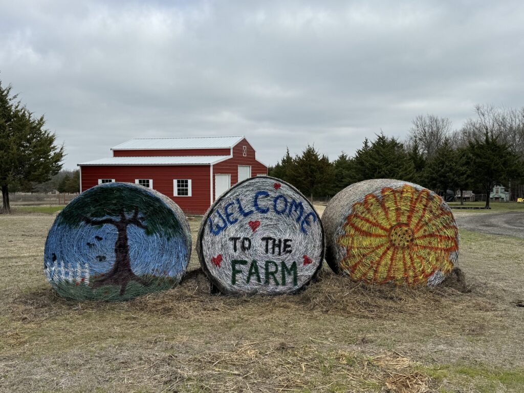 Welcome to the Farm sign with the red barn